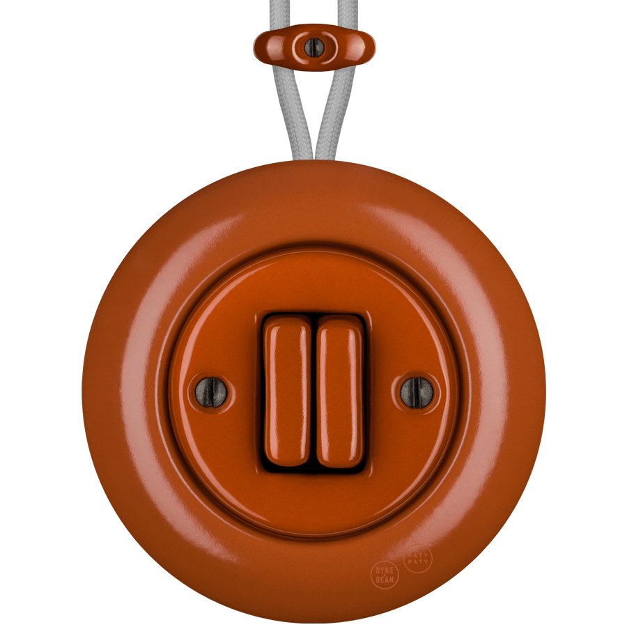 PORCELAIN KATY PATY COLONA ROUND SURFACE MOUNTED DOUBLE SLIM BUTTON SWITCH BRICK RED - DYKE & DEAN