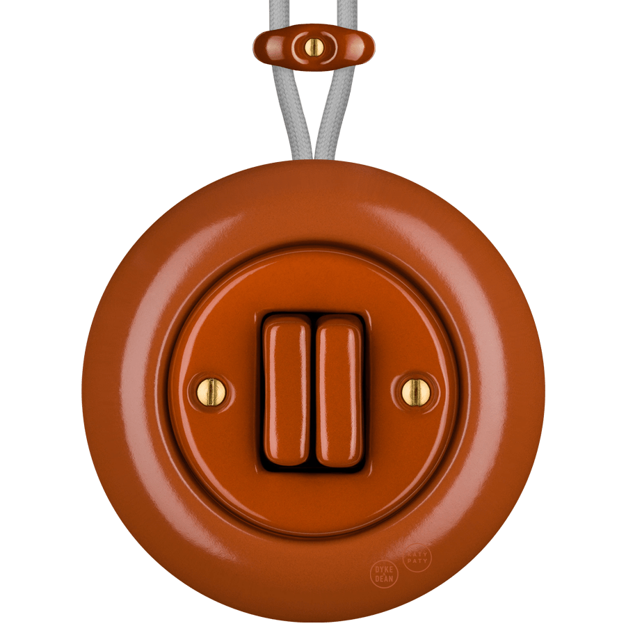 PORCELAIN KATY PATY COLONA ROUND SURFACE MOUNTED DOUBLE SLIM BUTTON SWITCH BRICK RED - DYKE & DEAN