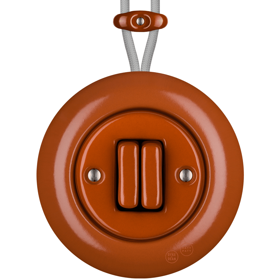 PORCELAIN KATY PATY COLONA ROUND SURFACE MOUNTED DOUBLE SLIM BUTTON SWITCH BRICK RED - DYKE & DEAN