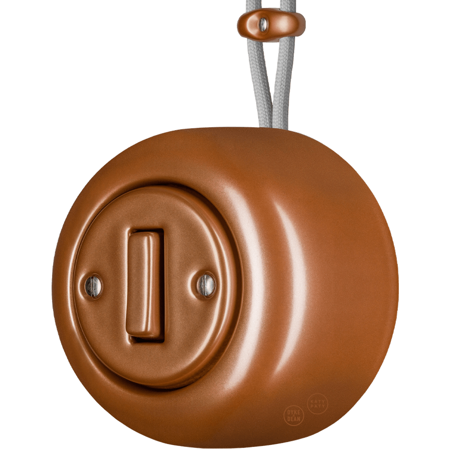 PORCELAIN KATY PATY COLONA ROUND SURFACE MOUNTED SLIM BUTTON SWITCH COPPER - DYKE & DEAN