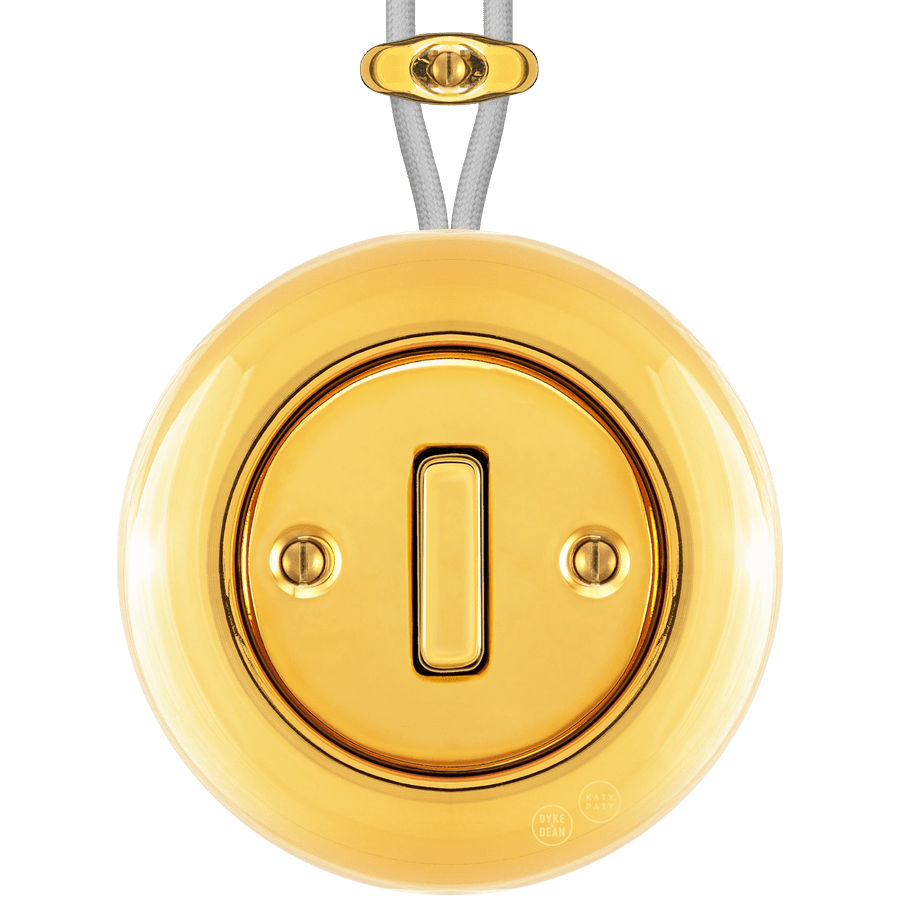 PORCELAIN KATY PATY COLONA ROUND SURFACE MOUNTED SLIM BUTTON SWITCH GOLD - DYKE & DEAN