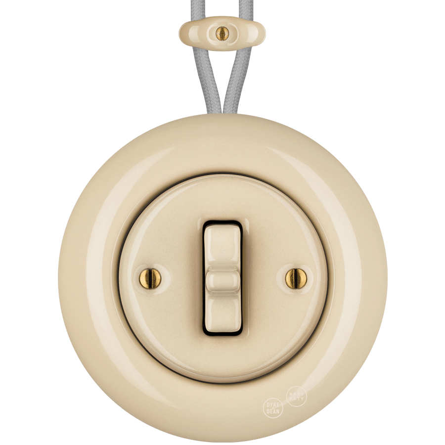 PORCELAIN KATY PATY COLONA ROUND SURFACE MOUNTED TOGGLE BUTTON SWITCH SAND - DYKE & DEAN