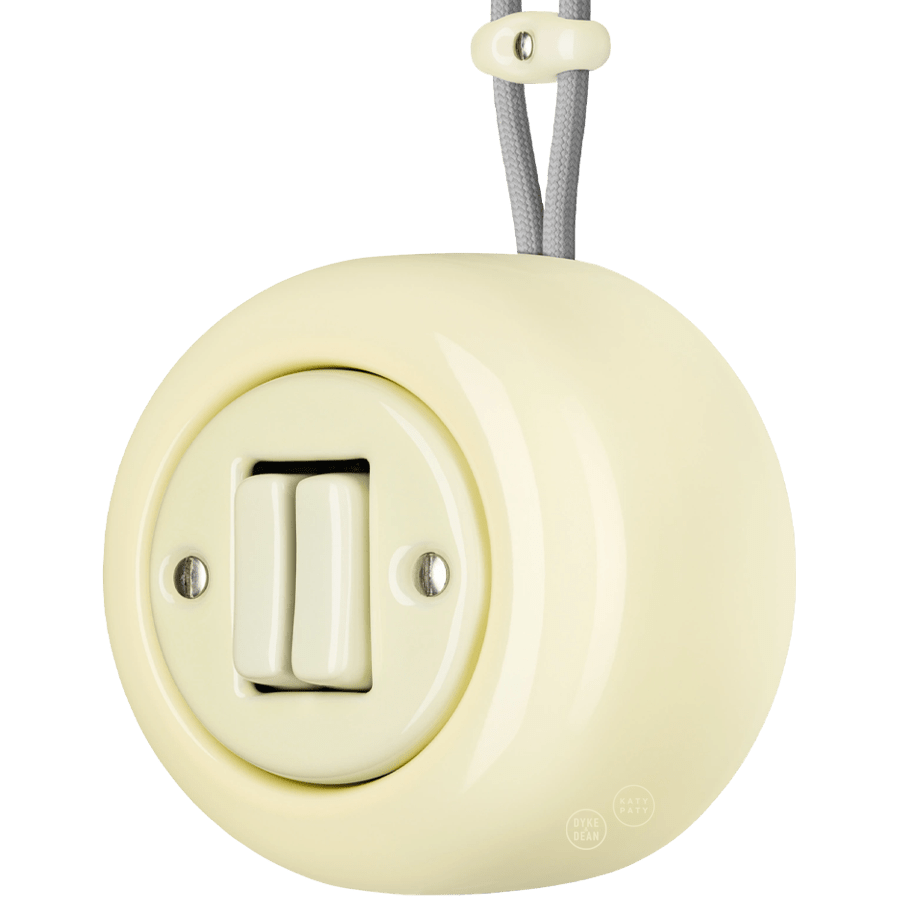 PORCELAIN ROUND SURFACE MOUNTED DOUBLE SLIM BUTTON SWITCH VANILLA - DYKE & DEAN