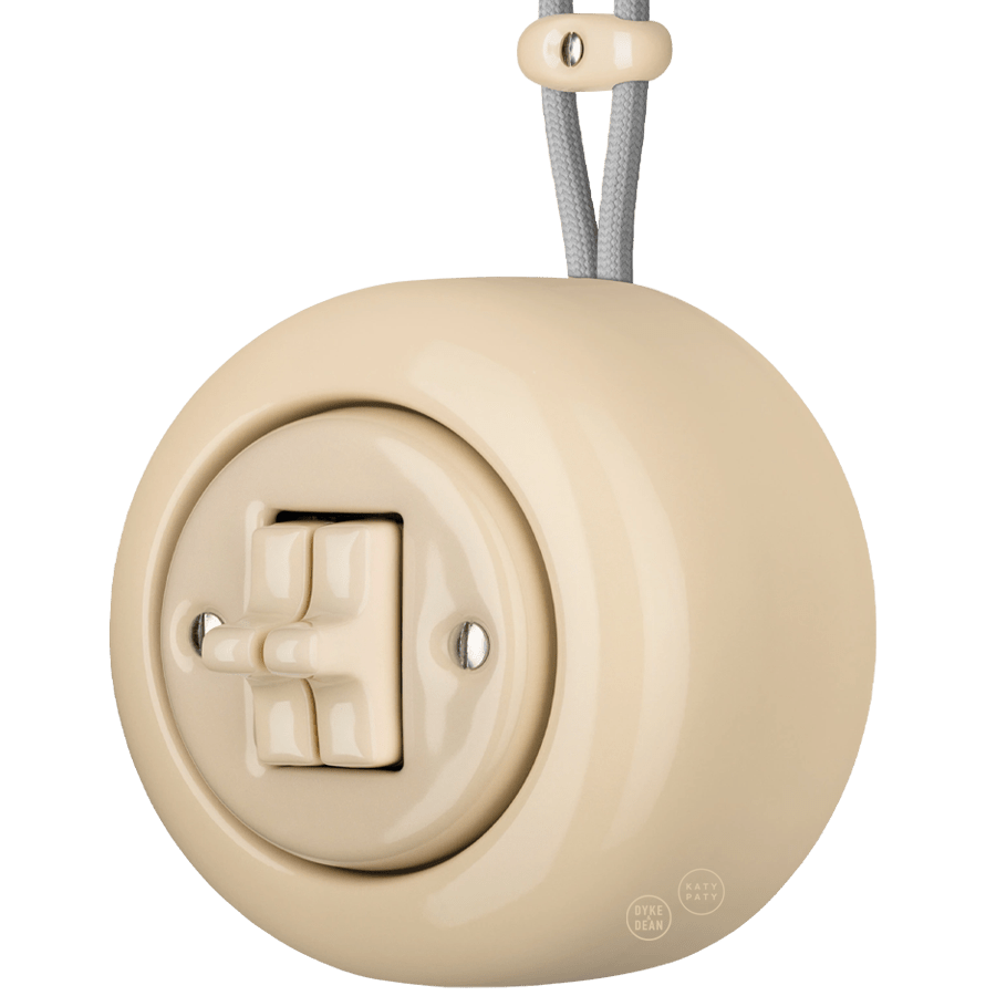 PORCELAIN ROUND SURFACE MOUNTED DOUBLE TOGGLE BUTTON SWITCH SAND - DYKE & DEAN