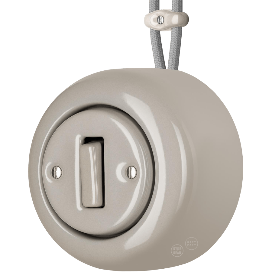 PORCELAIN ROUND SURFACE MOUNTED SLIM BUTTON SWITCH CAPPUCCINO - DYKE & DEAN